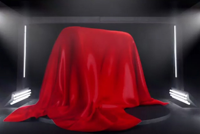 red cloth draped over something hidden